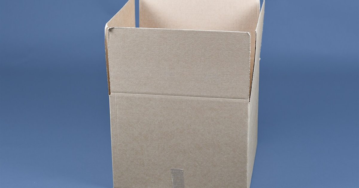 An empty open cardboard box against a blue background