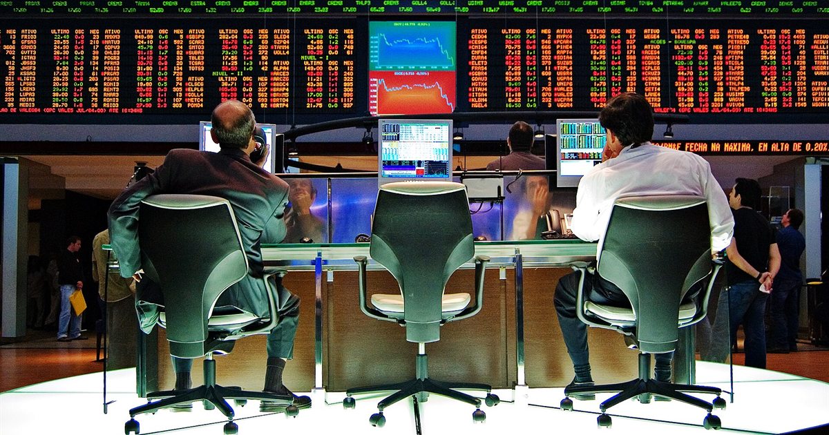 Traders' desks and electronic quote boards inside the São Paulo stock exchange