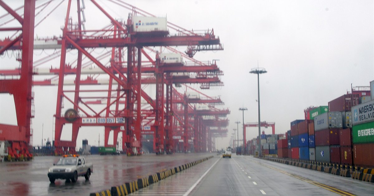 Container cranes and stacked shipping containers at Shanghai's Yangshan deep-water port