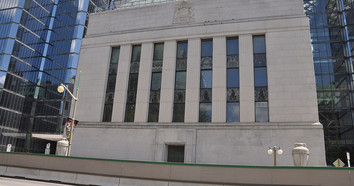 The Bank of Canada building in Ottawa, with its stone facade between glass towers