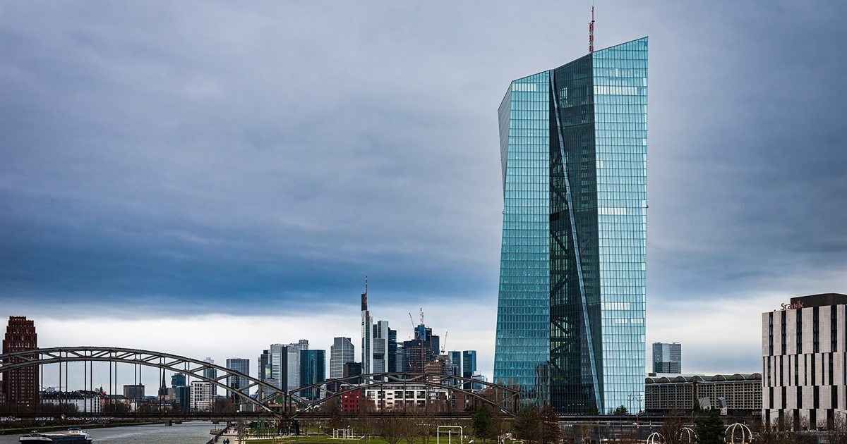 The European Central Bank tower in Frankfurt beside the River Main under a cloudy sky