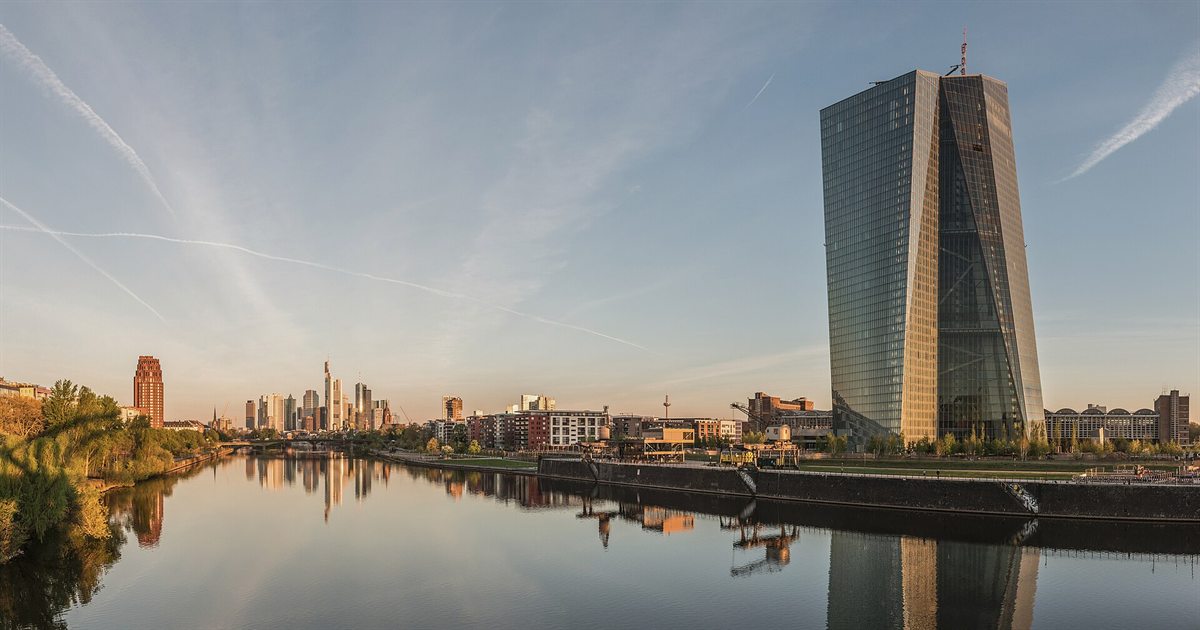 The European Central Bank tower beside the River Main in Frankfurt at dawn