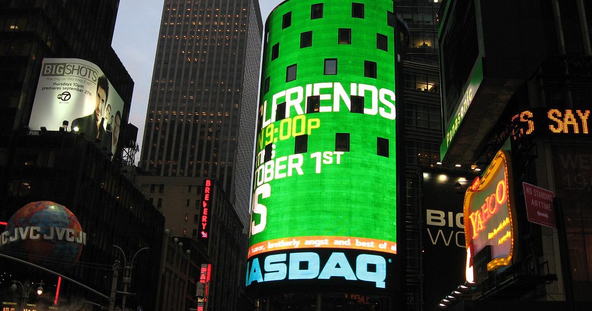 The illuminated Nasdaq MarketSite tower in Times Square, New York, at night