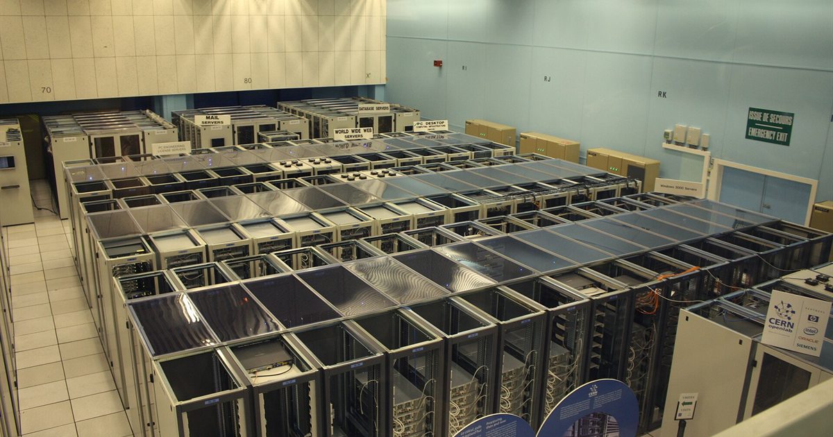 Rows of server racks inside a large data centre hall