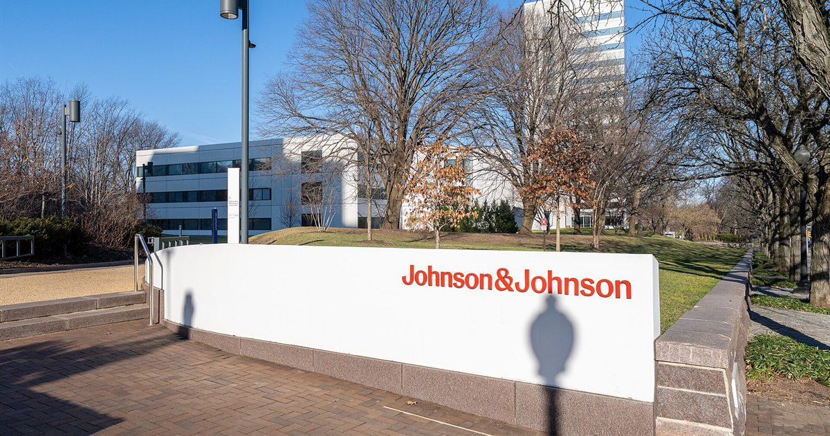 A Johnson & Johnson sign in front of company office buildings on a sunny winter day