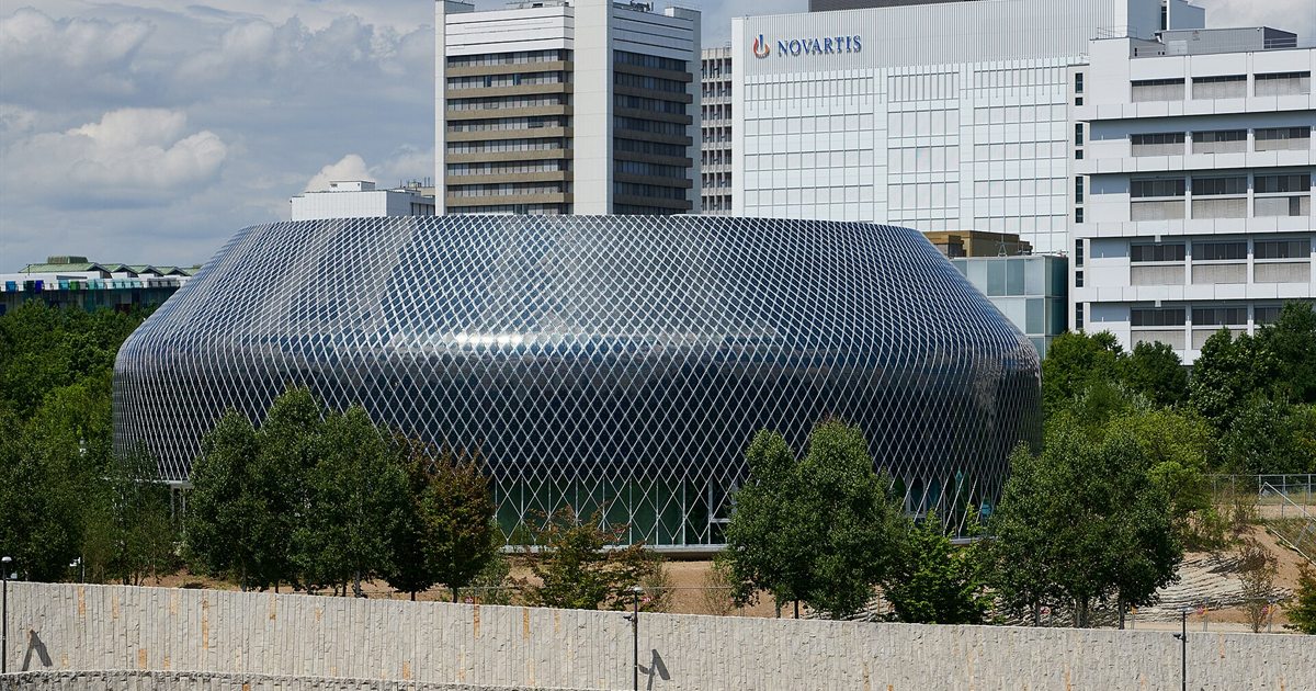 The Novartis Pavilion, a curved building with a lattice facade, on the Novartis Campus in Basel